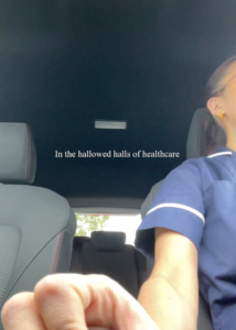 A woman sitting in the back seat of a car.