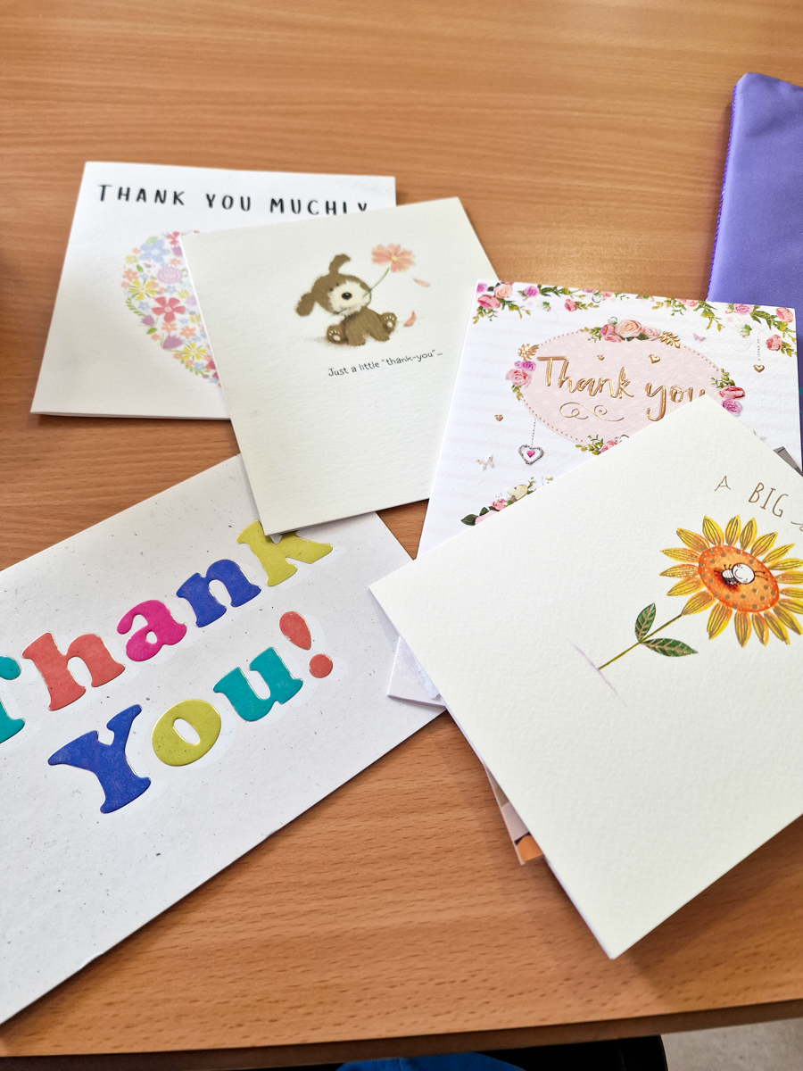 Thank you cards on a table.
