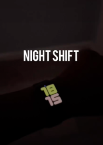 A person's wrist with the words night shift on it.