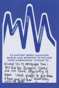 A blue and white sign with writing on it.