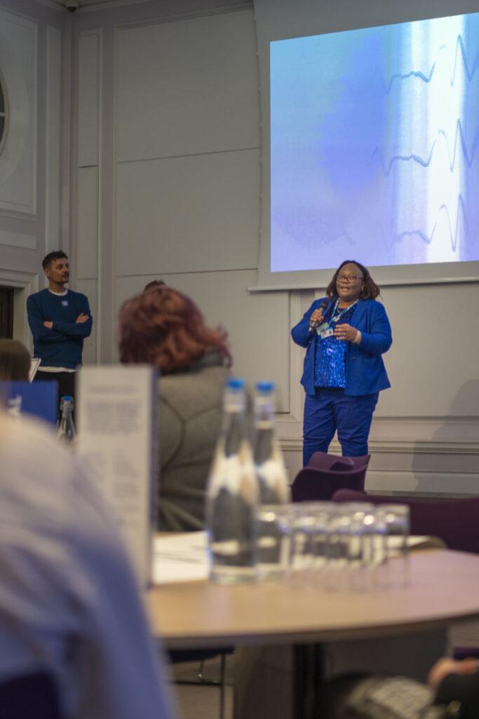 A woman is giving a presentation.
